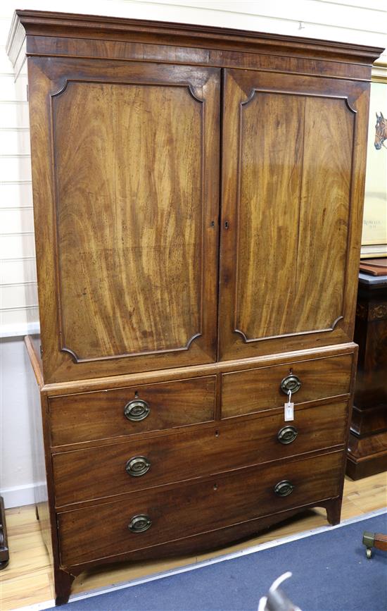 A Regency mahogany linen press fitted three sliding trays W.124cm